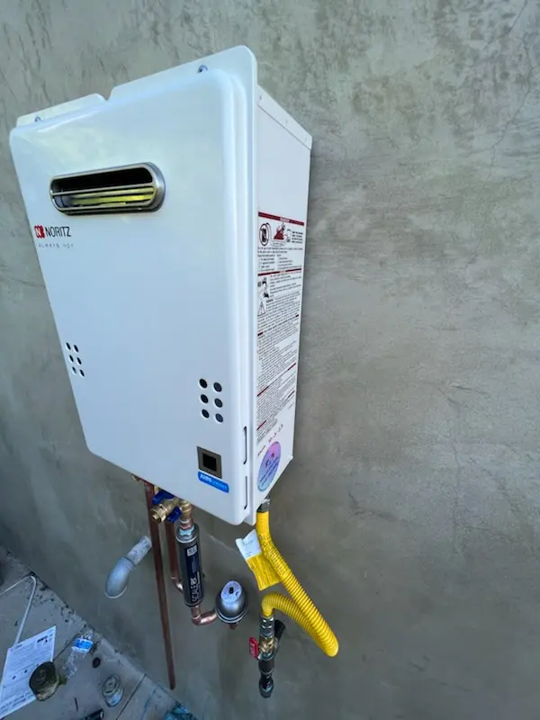 Tankless water heater installation for Forest N'hood Coalition homes